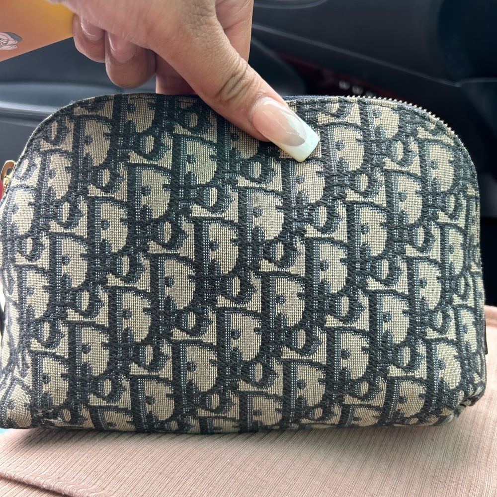 Dior small bag/makeup bag. Cute bag that’s very versatile
